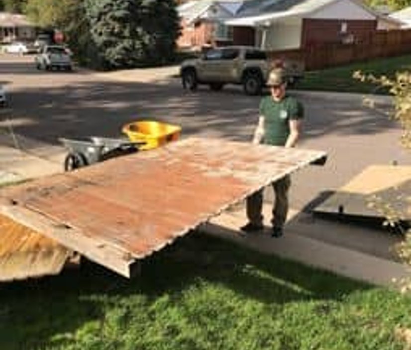 Junk hauling crew loading debris